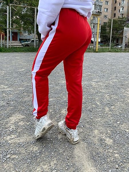 Спортивні штани жіночі бавовняні трикотажні з манжетами та лампасами